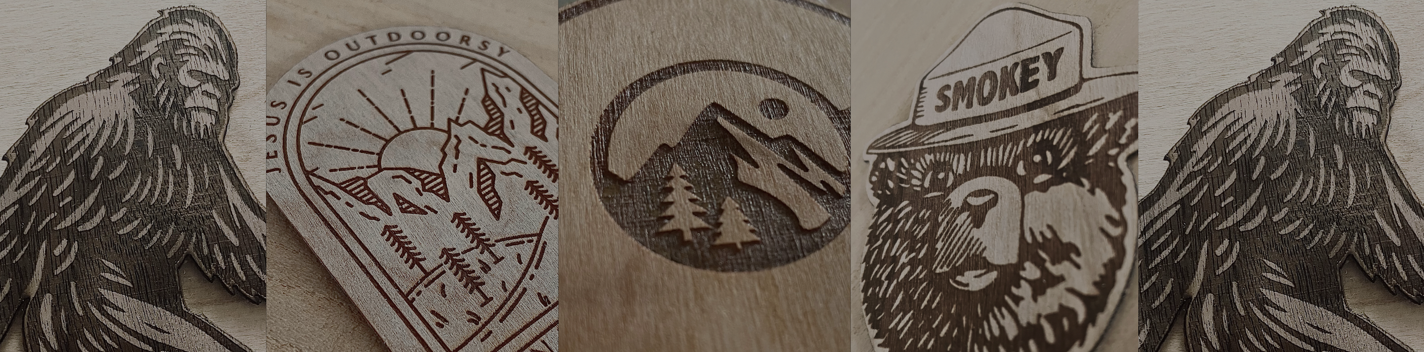 Close-up photos of Tappan Take laser-etched wood stickers: mountain scene, Jesus is Outdoorsy, Jonah and the whale, Smokey Bear, and Sasquatch